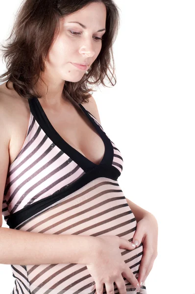 Gravid kvinna händer i form av hjärta tecken — Stockfoto