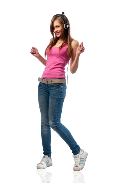 Dziewczyna w dżinsy i słuchawki — Zdjęcie stockowe