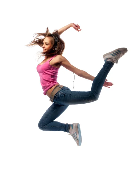Dziewczyna w słuchawkach skacze — Zdjęcie stockowe