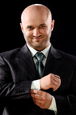 The businessman on a black background clipart