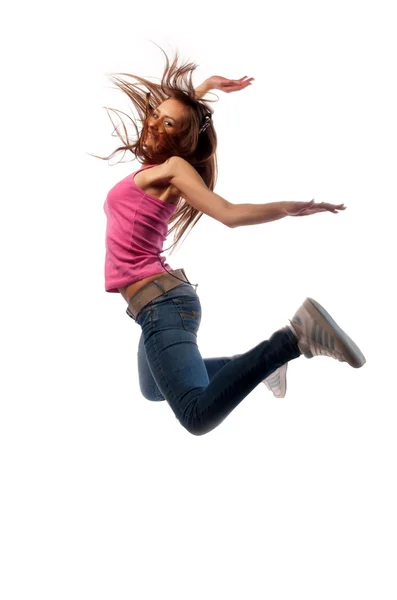 Meisje in hoofdtelefoon springt — Stockfoto
