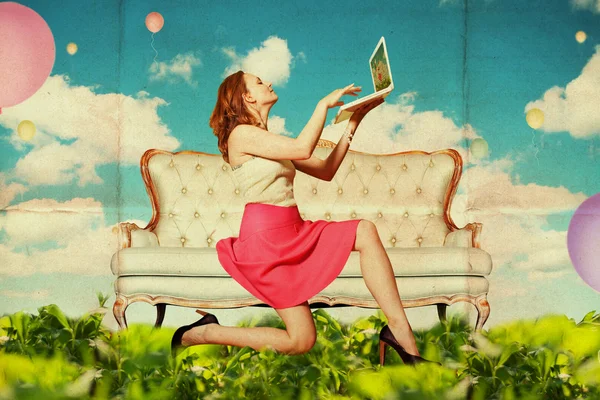 Beautiful woman with book in clouds — Stock Photo, Image