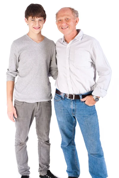 Teenager and grandfather, in studio — Stockfoto