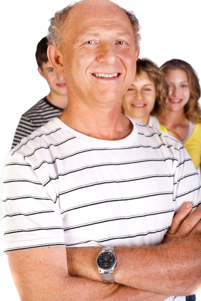 Glad familj, gammal man i fokus — Stockfoto