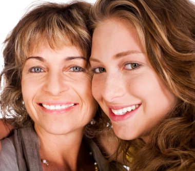 Close-up of smiling elder mum and daughter clipart