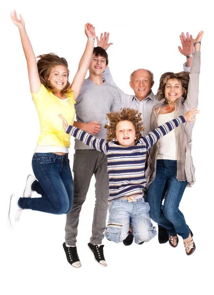 Feliz família saltando alto — Fotografia de Stock