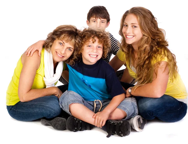 Feliz joven sonriente familia con dos chicos — Foto de Stock