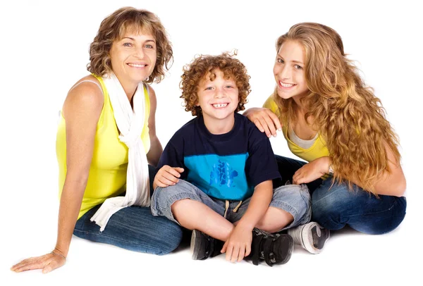 Family having fun on the floor, smiling at camera — Stock Photo, Image