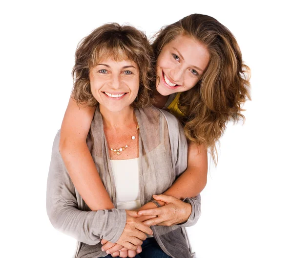 Pretty daughter hugging her mom from back — Stock Photo, Image