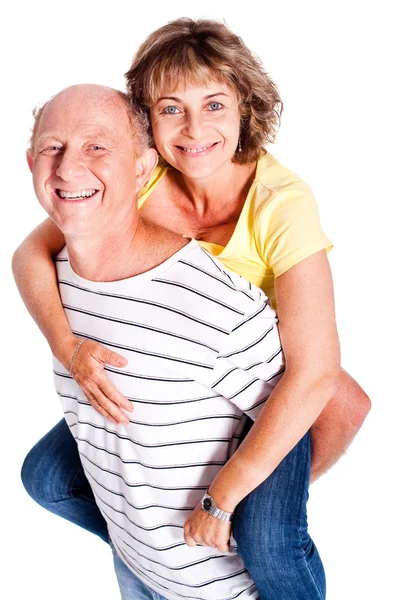 Starší muž dává žena na záda — Stock fotografie