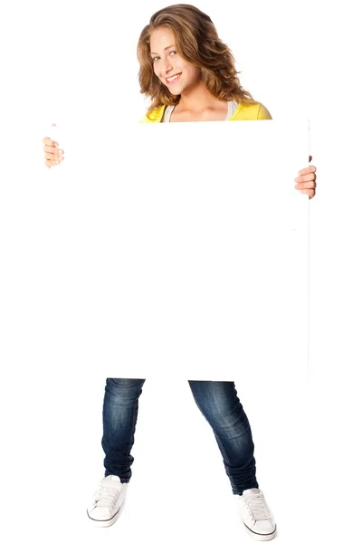 Beautiful woman holding empty white board — Stok fotoğraf