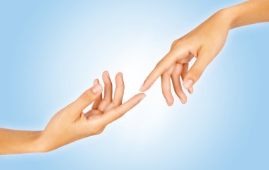 Finger tips reaching out each other, close-up clipart