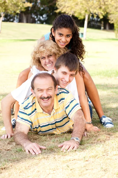 Family lying on top of each other Stock Picture
