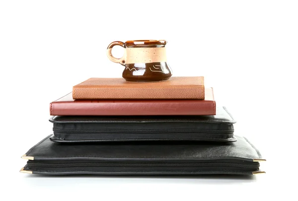 Pile of folders and organizers with a coffee cup — Stock Photo, Image