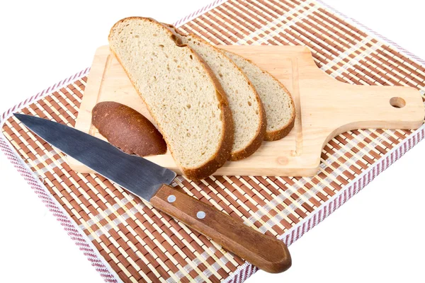 Plátky chleba nůž, prkénko — Stock fotografie