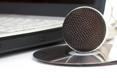 The microphone lays on notebook clipart