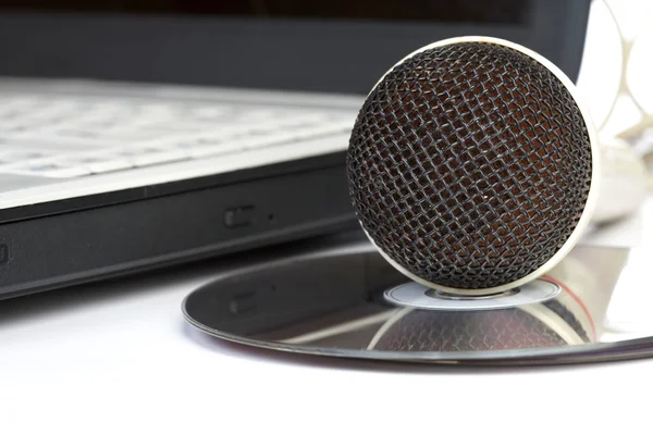The microphone lays on notebook — Stock Photo, Image