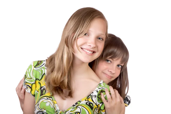 Dwie dziewczyny uśmiechający się na białym tle — Zdjęcie stockowe