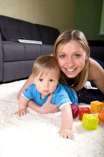 Young mother playing with baby boy — Stock Photo, Image
