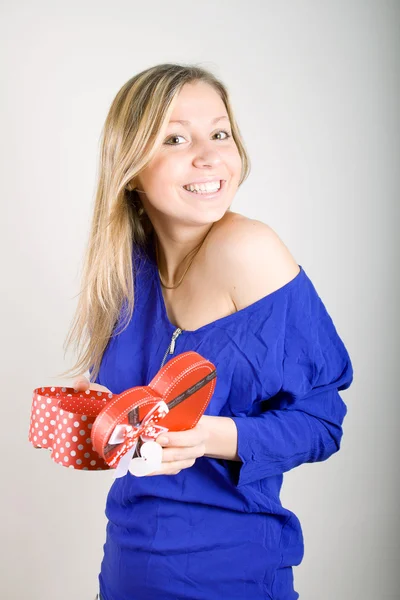 Woman with a red present gift — Stock Photo, Image