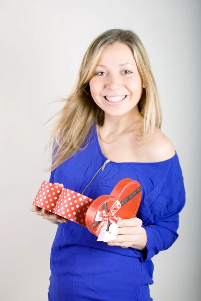 Woman with a red present gift Stock Picture
