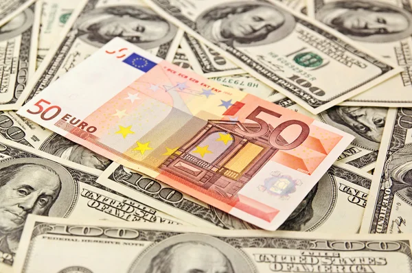 Dollar backround met euro — Stockfoto