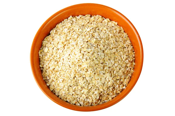 Cereali secchi di avena in ciotola marrone — Foto Stock