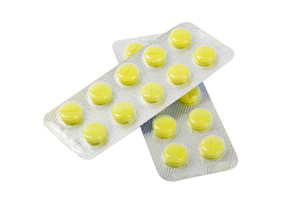 Package with yellow tablets — Stock Photo, Image