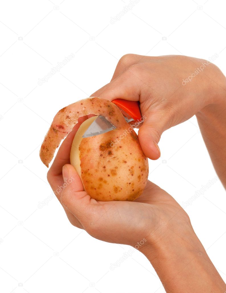 Hand holding knife peeling potato — Stock Photo © fanfon 6030285