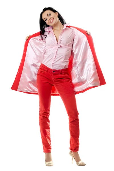 Веселая юная брюнетка в красном костюме — стоковое фото
