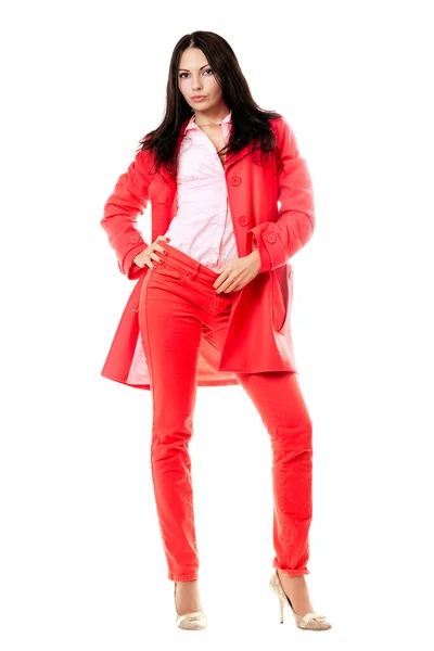 赤いスーツの美しい若いブルネット — ストック写真