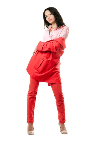 Bella giovane bruna giocosa in abito rosso — Foto Stock