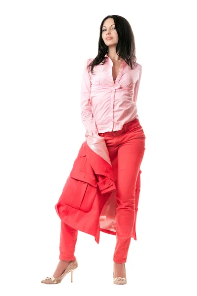 Verleidelijke jonge brunette in rood pak — Stockfoto