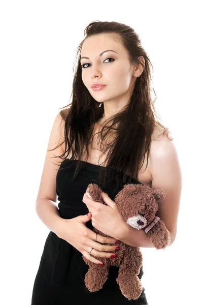 Speelse vrouw nemen teddy-bear — Stockfoto