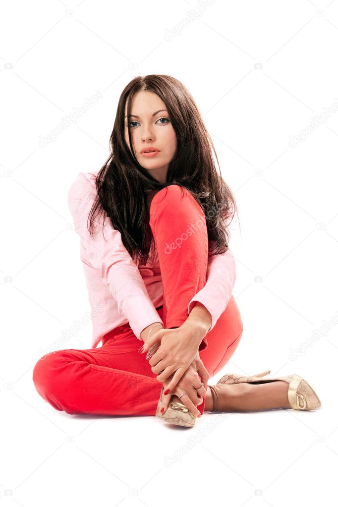 Beautiful woman in red jeans. Isolated