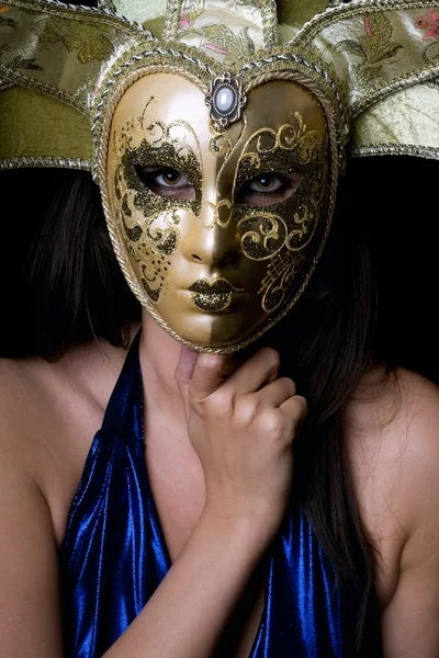 Portrait of young woman in a Venetian mask — Stock Photo, Image