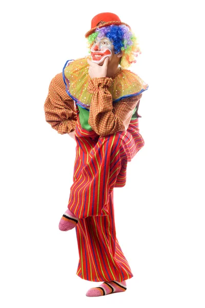 Legrační klaun stojí na jedné noze — Stock fotografie