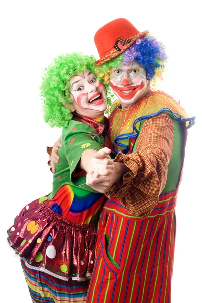 Een paar van lachende clowns dansen — Stockfoto
