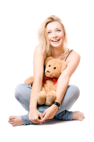 Glad blondin med en nallebjörn — Stockfoto
