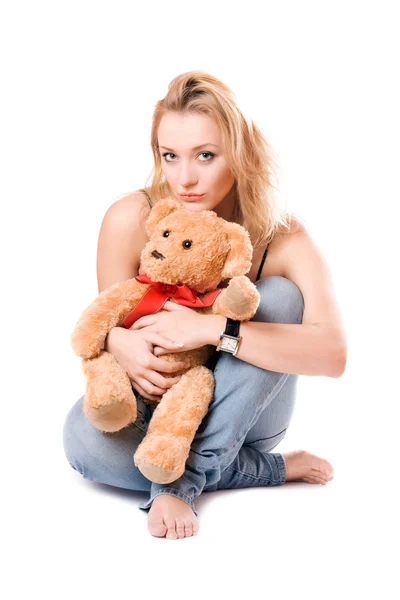 Vacker blondin med en nallebjörn — Stockfoto