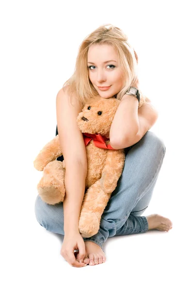 Lächelnde Blondine mit Teddybär — Stockfoto