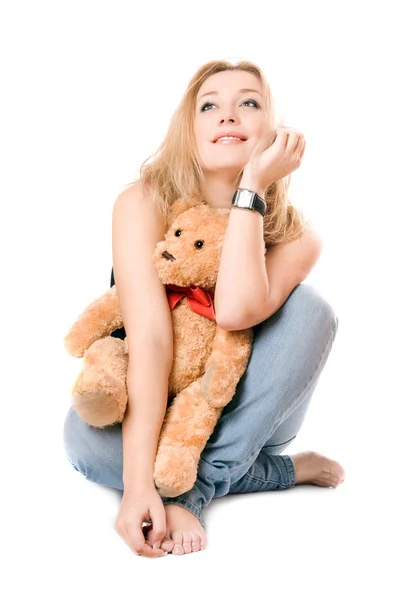 Ganska drömmande blondin med en nallebjörn — Stockfoto