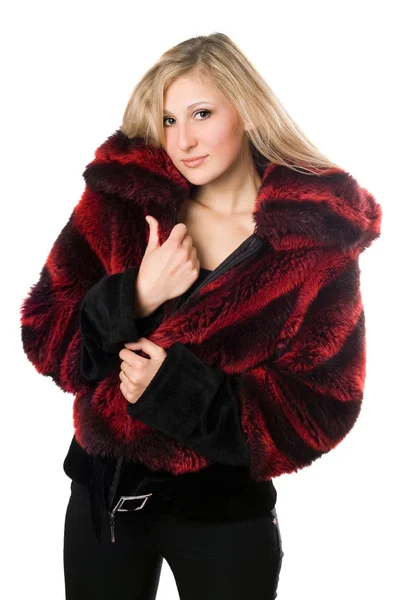 Sexy blond woman in a fur jacket — Stock Photo, Image