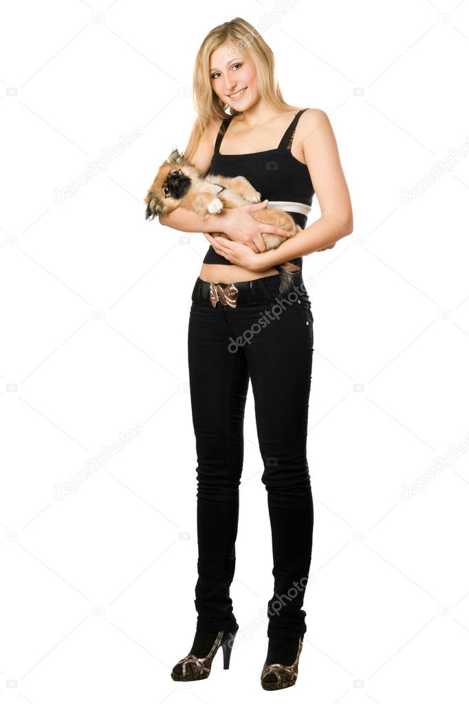 Woman in black holding puppy