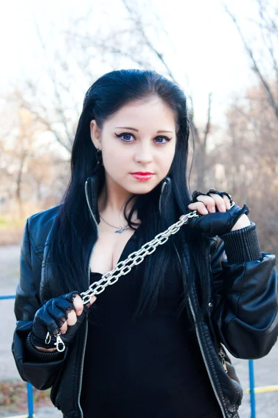 Young woman with a large chain — Stock Photo, Image