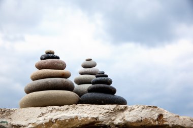 Pebble. Balanced stones on the beach clipart