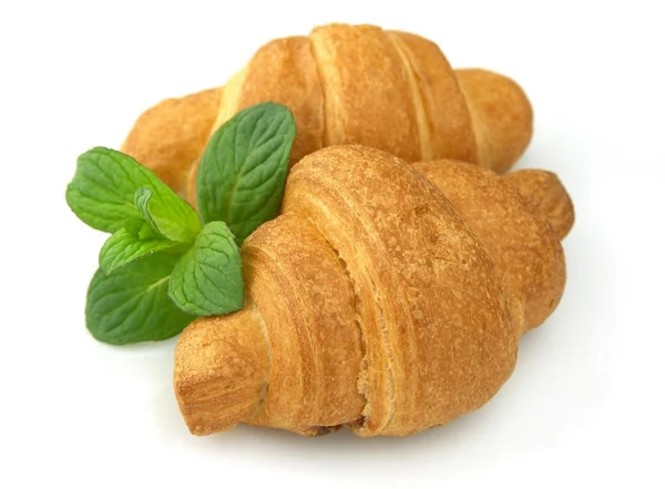Fresh croissants with mint — Stock Photo, Image