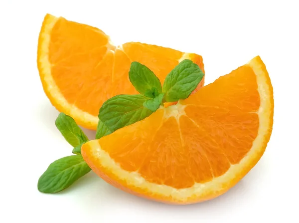 Segments of an orange with mint — Stock Photo, Image