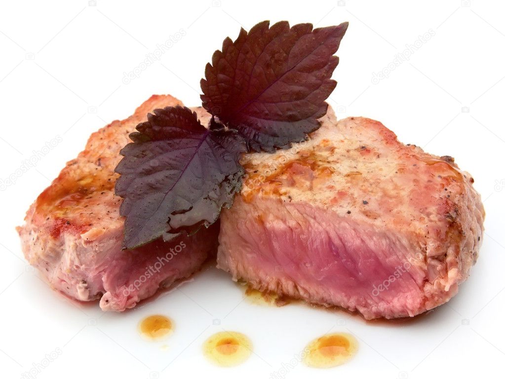 Juicy striped steak on wood table