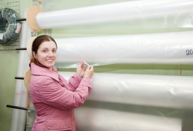 Woman chooses polythene for hothouse clipart